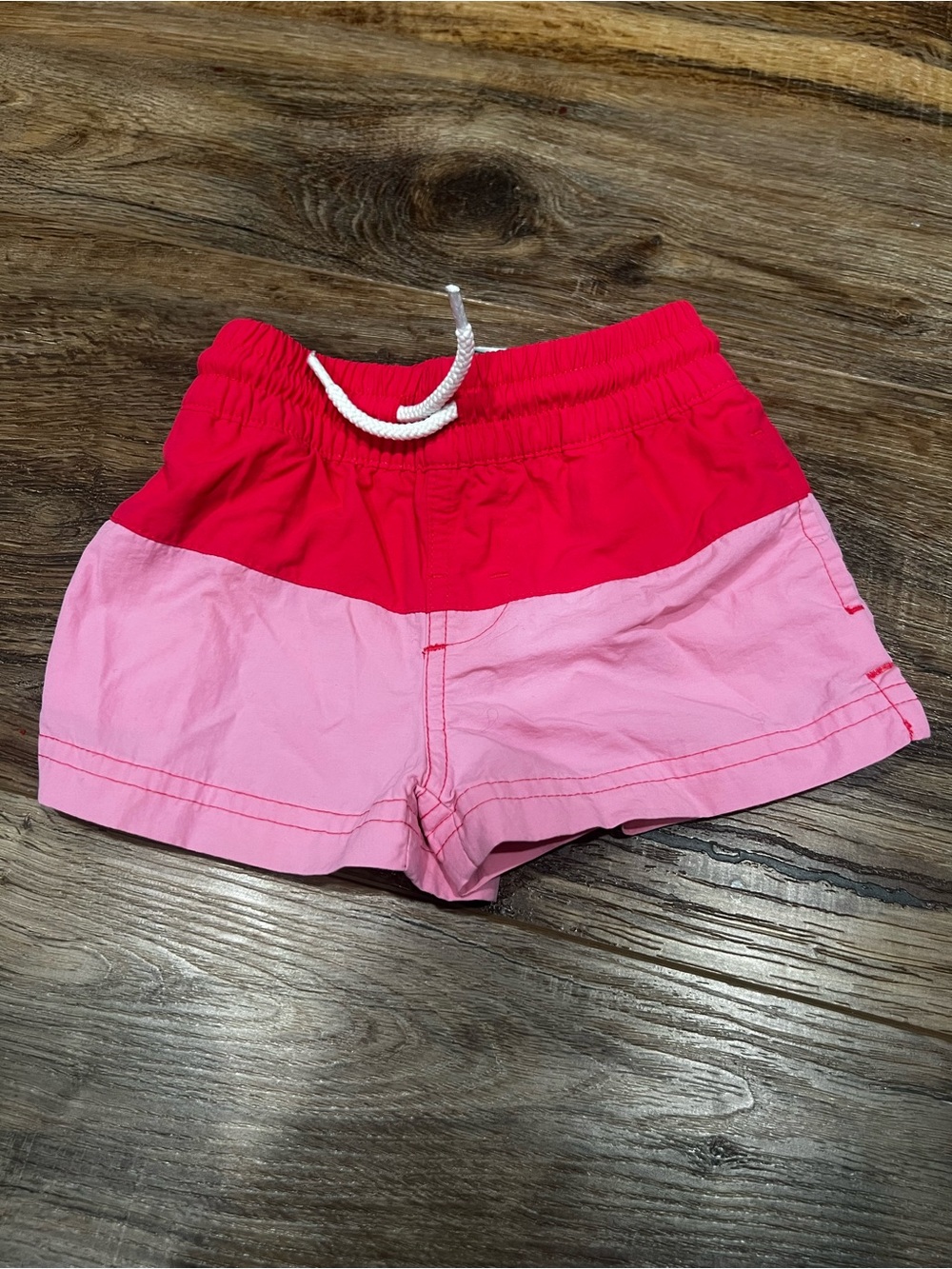 The Beaufort Bonnet Company Kids Swim Trunks in Red and Light Pink - size 6-12 M